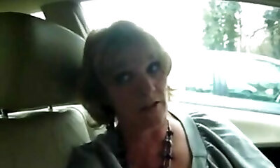 Mature wife gives good suck to man on car