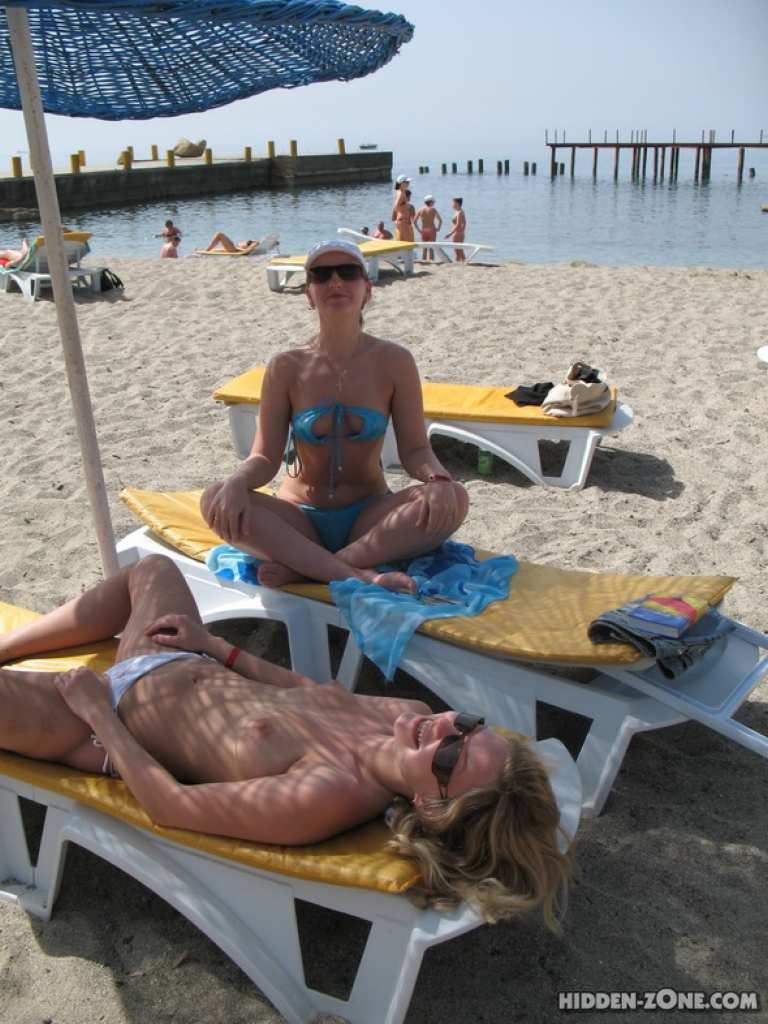 Beach spy voyeur captures two friends sunbathing topless