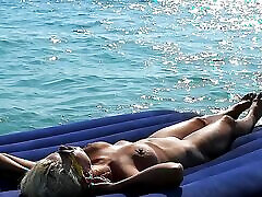 I watched on the play game bikini how a naked girl with big tits was sunbathing on a mattress. Slow motion