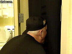 Gloryhole BJ DILF sucks cock with eager mouth near toilet