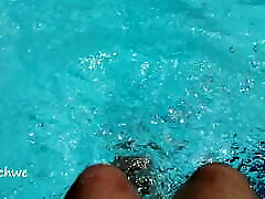 Feet in the pool with a lot of water