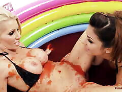 Two sexy lesbians are rolling in the mud pool and having some soft prague public porn action