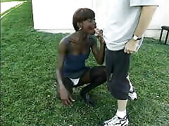 Amazing black woman gets white dedy aur mom and sucks it staying on her knees on the grass