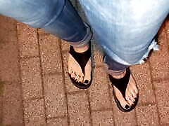 I tempt you with my sexy feet while walking on the street