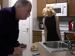 Mature blonde spanks young blondes ass