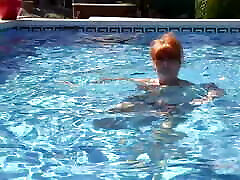AuntJudys - Busty amateur magazine photographer Redhead Melanie Goes for a Swim in the Pool