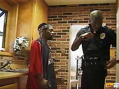 Black Police Guy Sucks a Dude and Bangs His Ass in the Kitchen