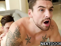 Tattooed dude catches his friend while jerking his sausage