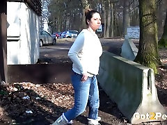 Chubby shameless brunette squats down and pisses outdoors right away