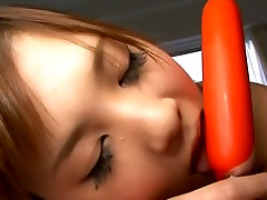Cutie from Japan Nozomi Chan sucks a dildo like a real dick
