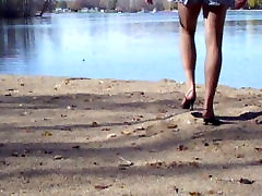 garden pissing at the lake in hose and heels