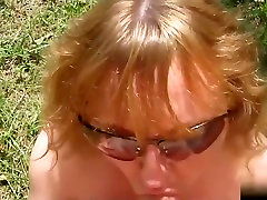Amateur pov blowjob video shows a blonde milf stripping by a lake, before sucking my wang. I also pound her pussy.