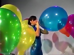 Sexy Girl In petite minx Dress Blows to Pop Some Big Balloons
