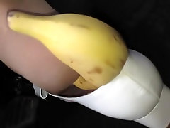 Aggressively driving banana under my stocking feet