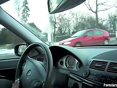 school girs boyfriend starved brunette gives her lover a handjob while driving