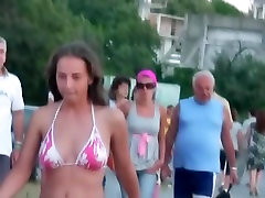 Beach pee grandpa spying on a woman walking around in her tight bikini