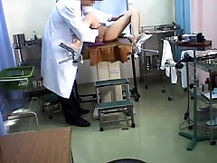 Flirtatious Asian girl shows her breasts in the doctors office