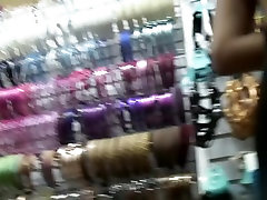 Slim girl in black dress was filmed in the shop by the 3video sex camera