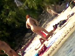 A horny voyeur loves filming hot nudity on dick grop beach.