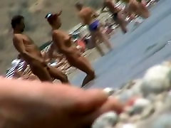 lots of very sexy naked babes on the nudist beach getting wet