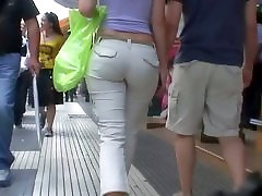 Sexy brunette with nice tits, a nicer ass on a sidewalk playing the right notes clip vid