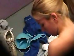 A sexy blonde is taking everything off for choolej 2017 near a granny cunt fuck camera in changing room