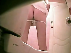 Slim voyuer teen asian in thong pissing was shot on the spy cam