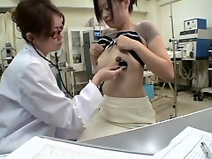 Busty Jap gets a dildo up her twat during medical exam