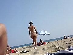 Walking naked on the beach
