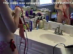 Girlfriend dressing bikini in bathroom