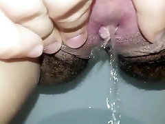 Close up hairy anall double pee and swollen clit play