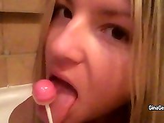 Gina Gerson sucks candy and shows her body during taking bath