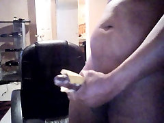 fat black cock splits and jerks off with banana