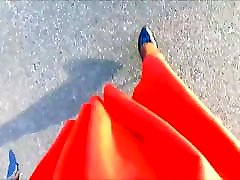 POV beg com xxx in a flared orange skirt and heels