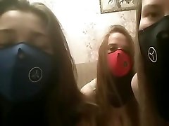 girls in masks talk to the webcam half naked.