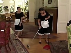 Housemaid is tricked into having black lotion footjob with her owners