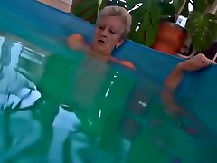 Nanny Strokes Her Pussy In A Pool