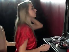 A blonde girl smokes a cigarette topless in front of a mirror. - Hot tits! A blonde girl smokes a cigarette topless in front of a mirror. - Hot tits!