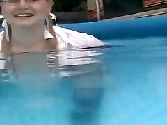 Schoolgirl swimming in pool