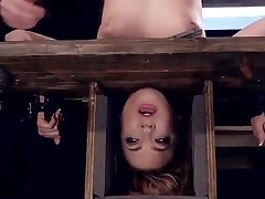 Brunette hanged with head in box bondage