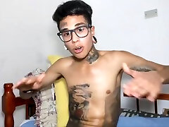 handsome tattooed skinny guy jerking off his huge licking pussues cock