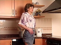 Older Milf Using A Vibrator In The Kitchen