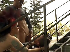 Babe gives blowjob at stairs outdoor