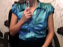Smoking blonde enjoys her glass sex toy