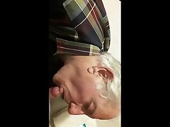 clothed granddad lies in bed and sucking hairy mans cock