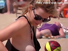 Fit topless blonde with hot natural tits on the beach !