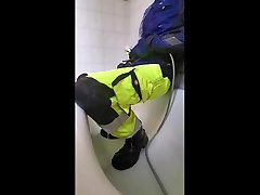 piss and shower in hi viz work pants and blue mascot jacket