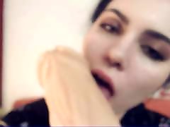 StacyMoon is sucking and licking a giant dildo