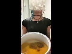 Transgirl pouring huge bucket of piss over head in satin Transgirl pouring huge bucket of piss over head in satin