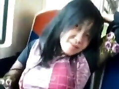 Asian daddy play daddy rubs her clit on a train.